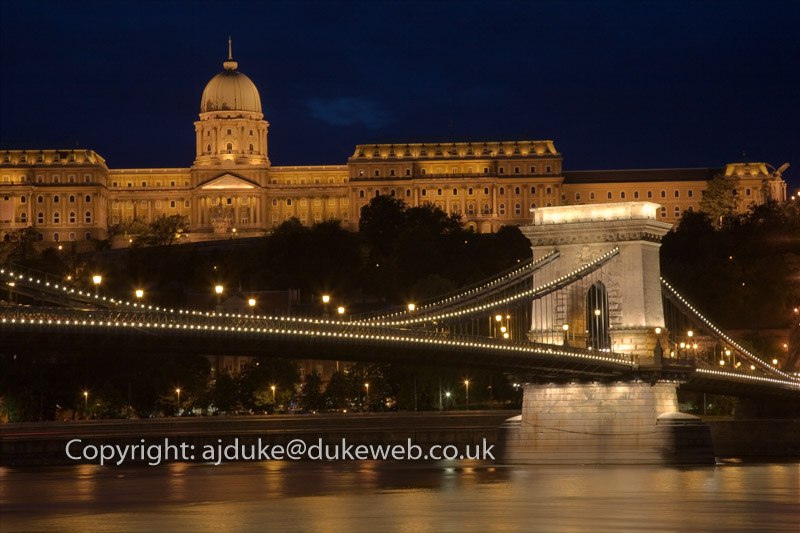 Chain Bridge over the Danube river and Royal Palace on Castle Hill at night, Budapest