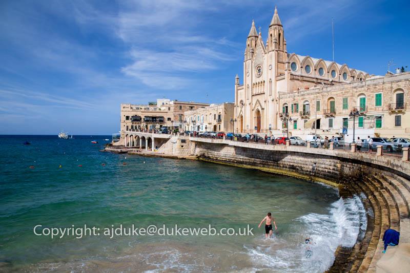 Balluta Bay area of St.Julian's Bay and Church of Our Lady of Mount Carmel, Malta