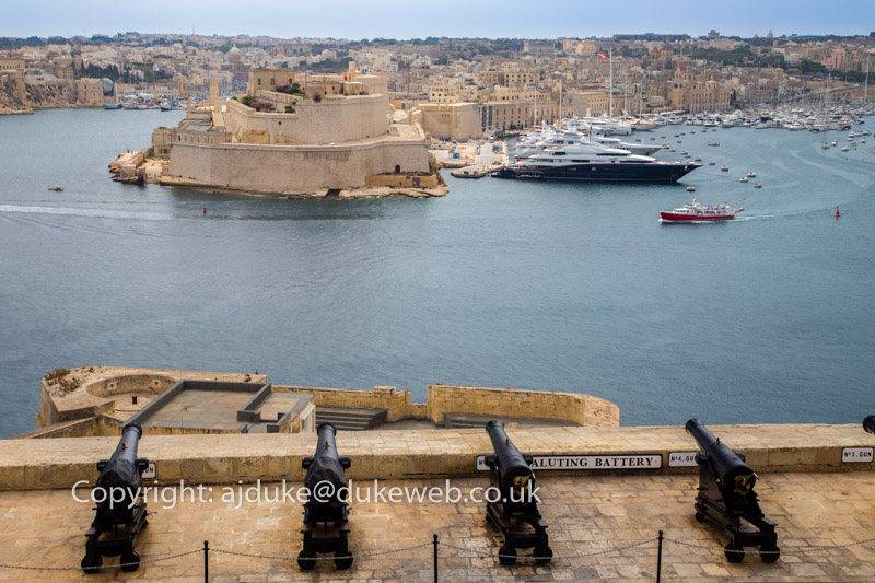 View from Valetta Upper Barrakka gardens over the Saluting Battery cannons to the Grand Harbour and Senglea Three Cities area, Malta